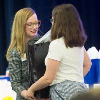 PSS sharing a gift at luncheon